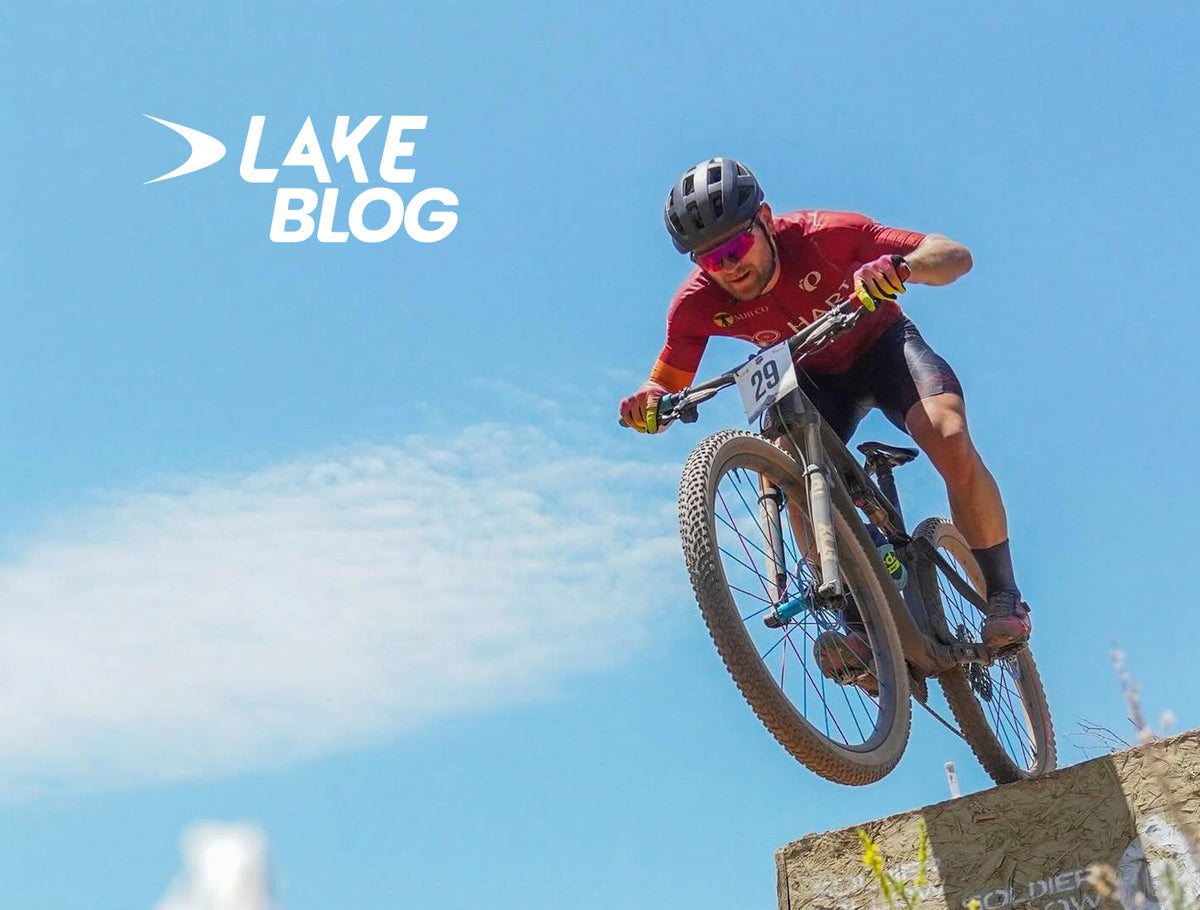 Mountain biker riding a trail in Lake MTB shoes